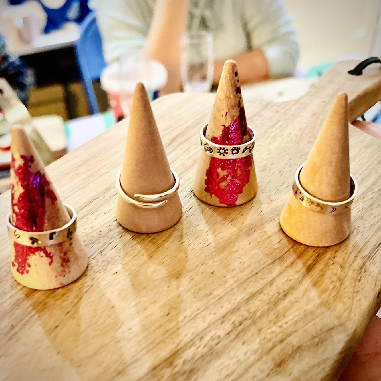 four textured silver rings 