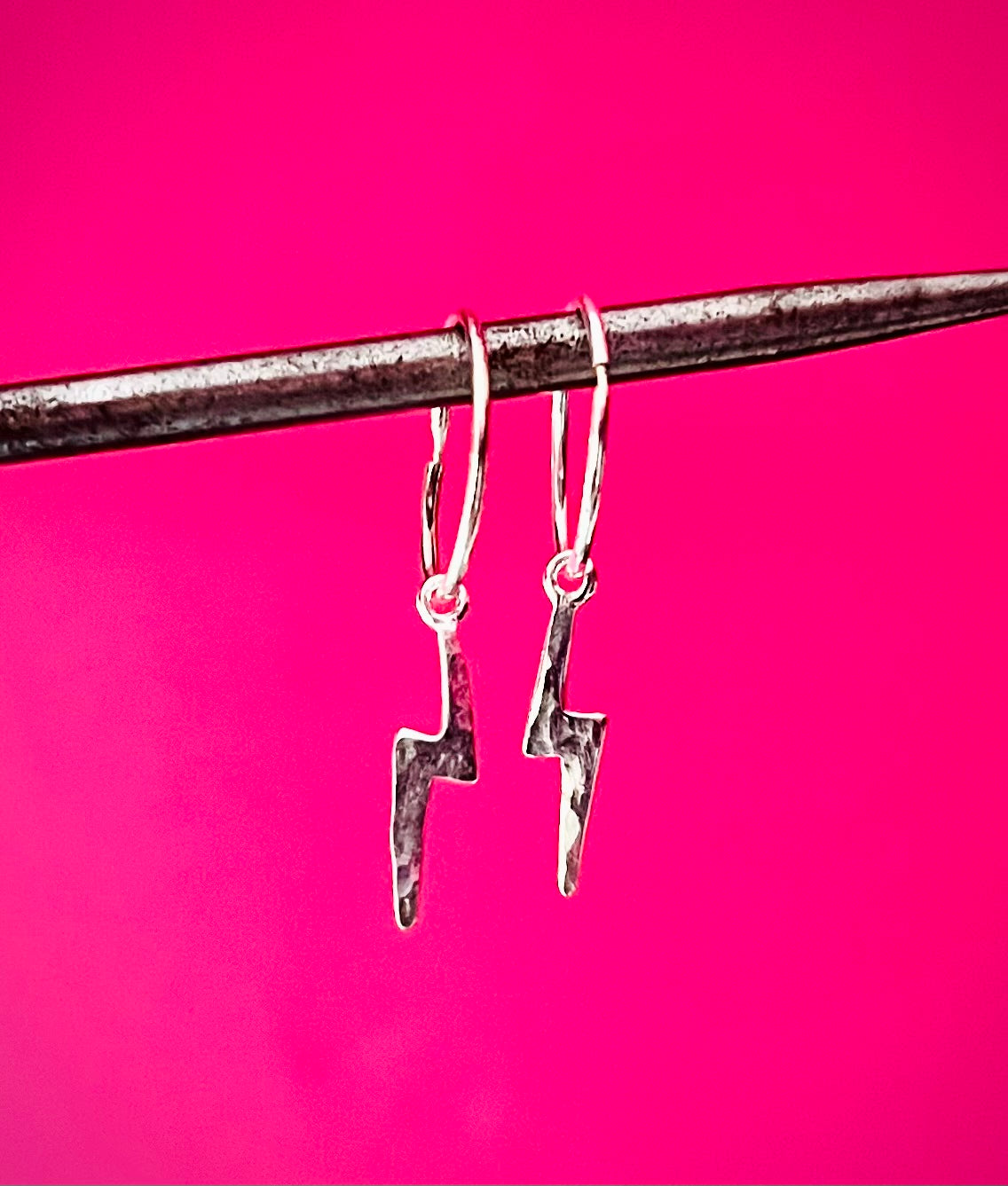 Silver sleeper earrings with silver lightning bolt accent against a pink background | Silverlicious Artisan Jewellery