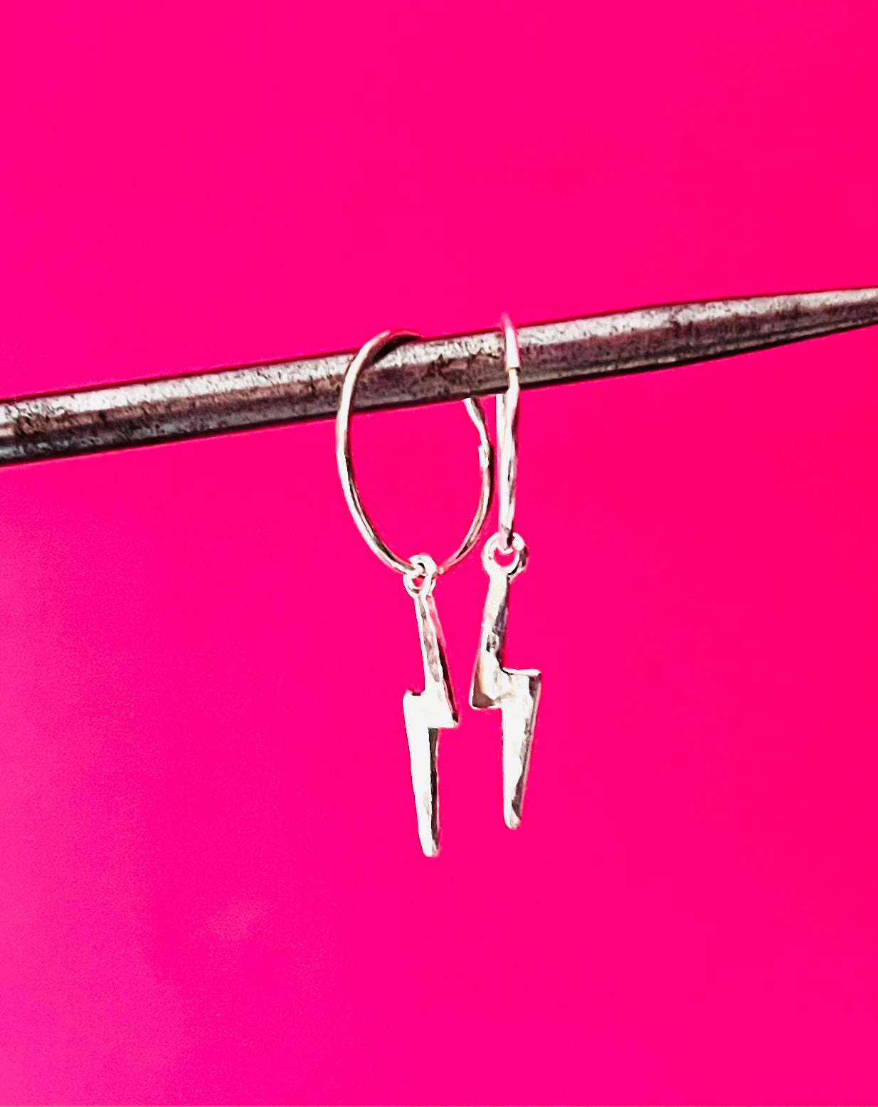 Silver sleeper earrings with silver lightning bolt accent against a pink background | Silverlicious Artisan Jewellery