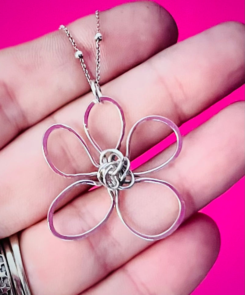 Hand holding Whimsical Bloom Silver Flower Pendant | Silverlicious Artisan Jewellery